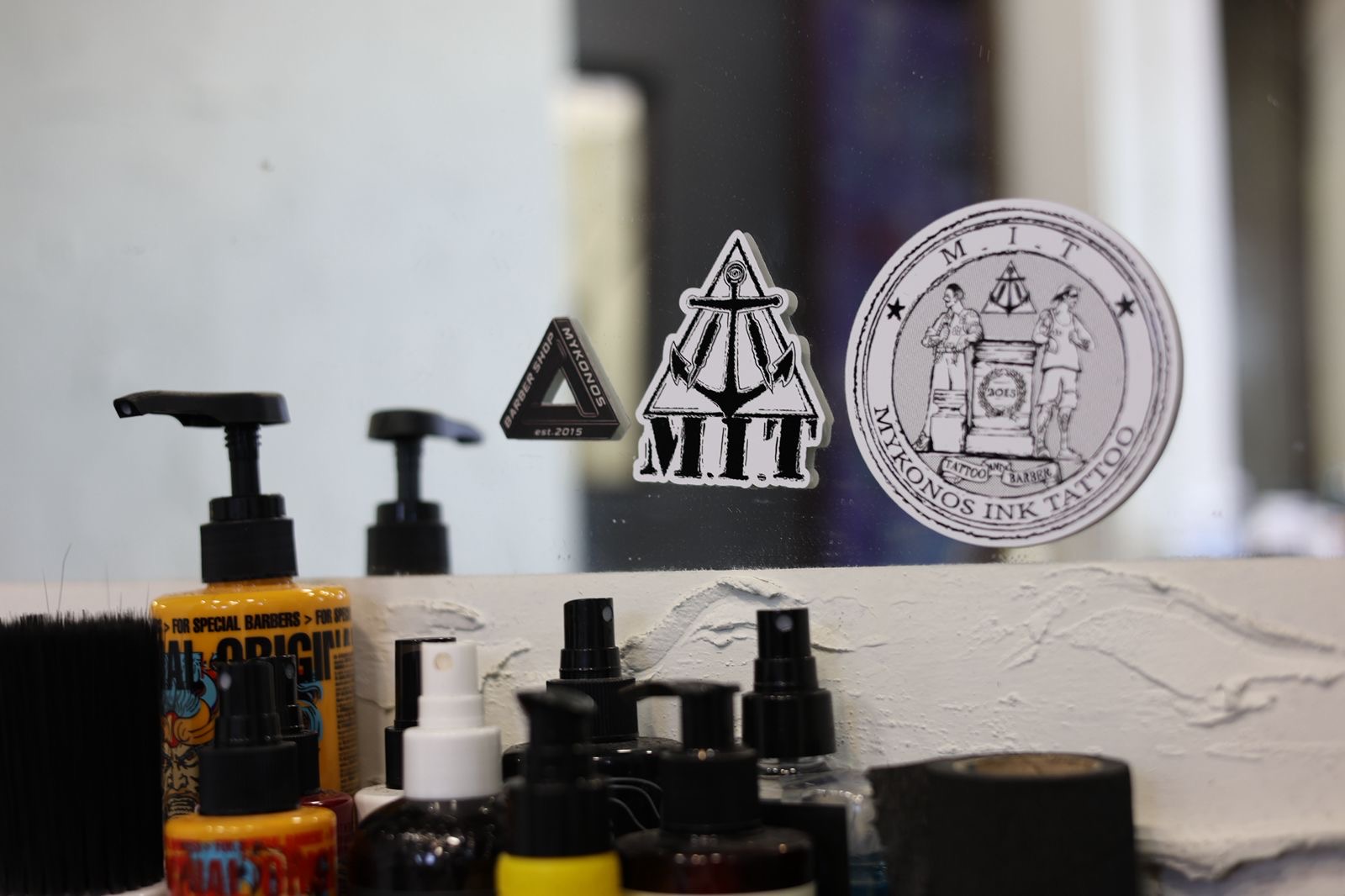 M.I.T anchor stickers on the studio mirror with tools and products